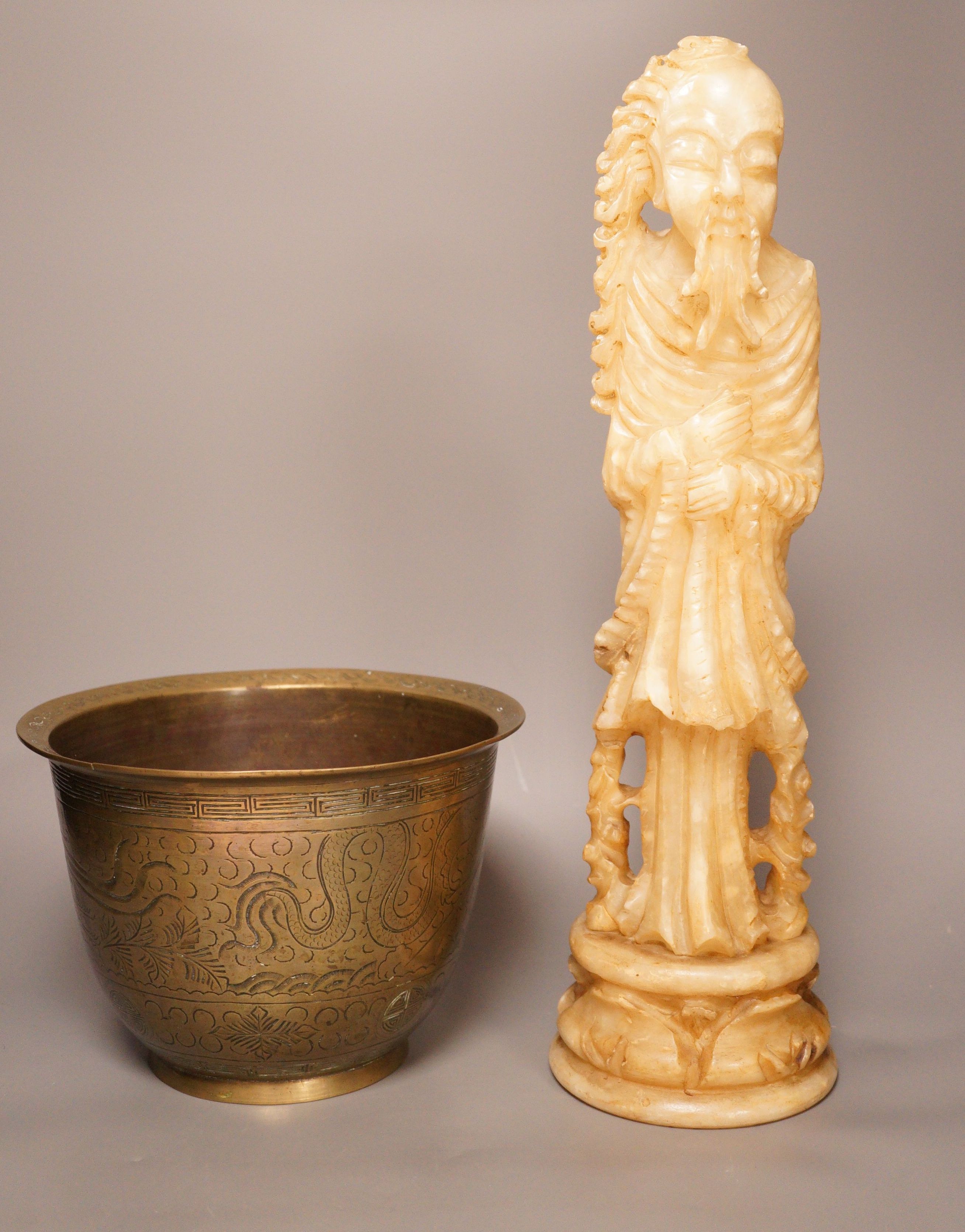 A Chinese bronze 'dragon' bowl, early 20th century and a large Chinese soapstone figure of Shou Lao, 28cm tall
